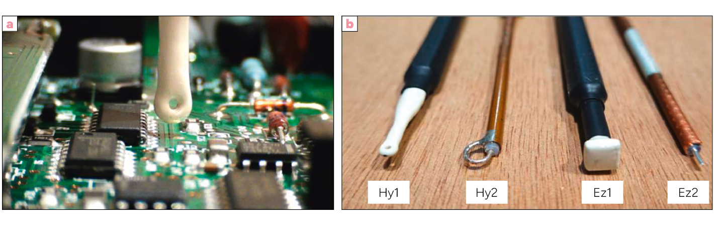 Un circuit électronique avec une sonde en train de mesurer un composant à gauche et quatre sondes de différentes formes et tailles posées sur une surface en bois à droite.
Description générée par IA
